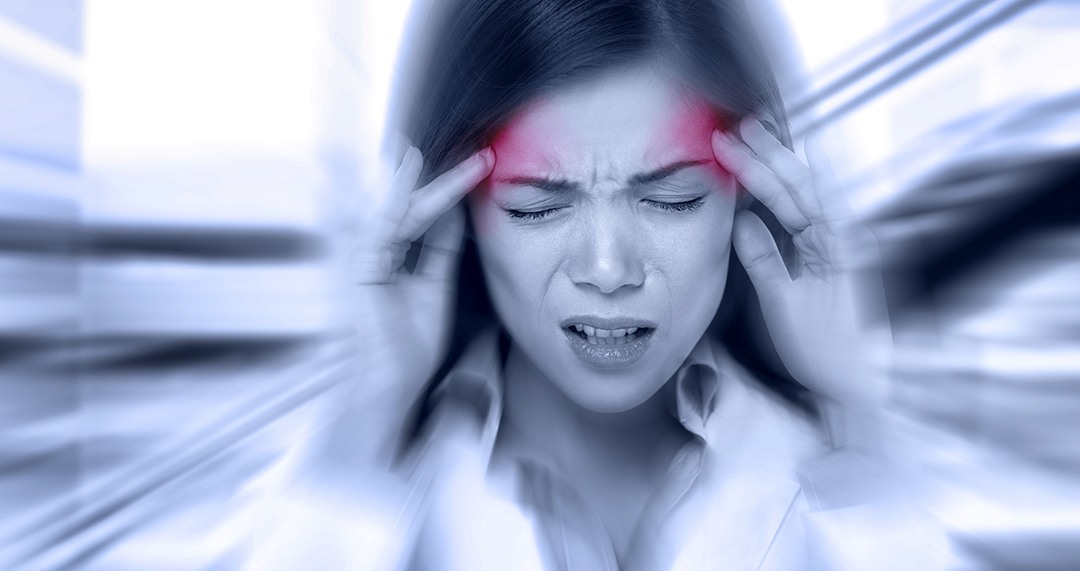 Headache migraine people - Doctor woman stressed. Woman Nurse / doctor with migraine headache overworked and stressed. Health care professional in lab coat wearing stethoscope at hospital.